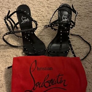 Christian Louboutin black, spiked heels.